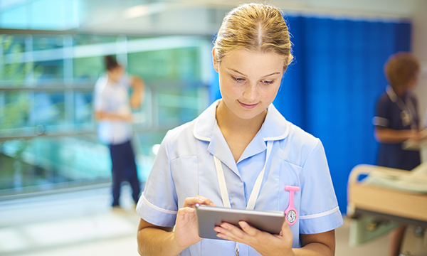 Nurse using digital aid