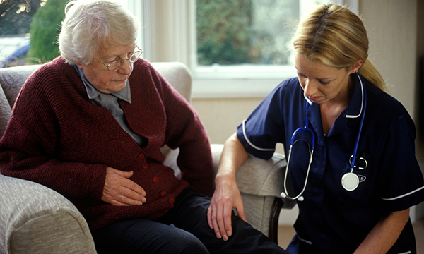 district nurse with patient