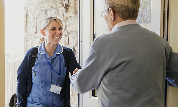district nurse visits a patient