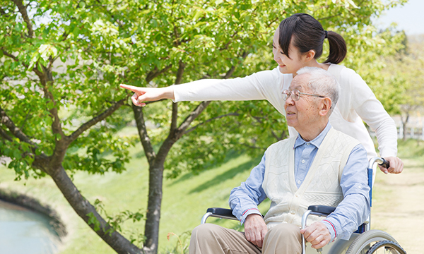 man looking at nature with support of carer