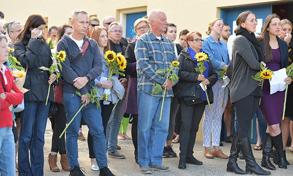 mourners with sunflowers