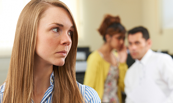 woman notices people whispering