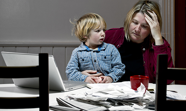 A woman sitting with a child on her knee