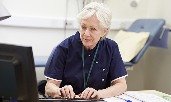 nurse works at computer
