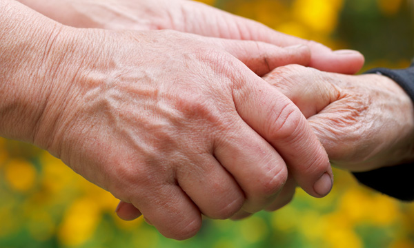 Carer hand holding