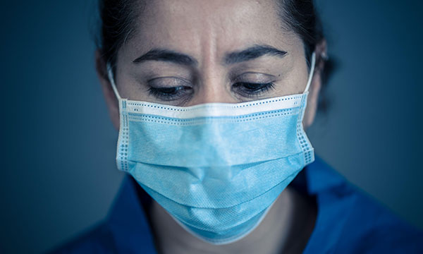 Picture of a female medic wearing a mask