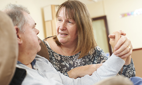 The RCN Foundation recently hired researchers from the London School of Economics to examine what the economic case for learning disability nurses is. A nurse holds the hand of a man with learning disabilities while talking to him