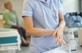 nurse washes her hands