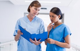 Picture shows two women in scrubs, the older one frowning at the younger one, who is looking at a folder. Being on the receiving end of incivility is always unpleasant but in a healthcare setting it can be dangerous.