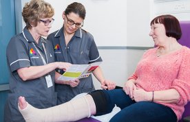 Accelerate director of education Karen Staines and wound care specialist Gabriela Kom, with a patient