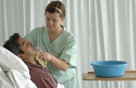Nurse washing a patient