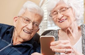 Two older people going through a video consultation on a smart phone. Consultations can now take place via video call over the internet. Picture: iStock