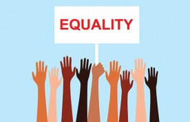 hands suggesting diverse racial heritage raised below a banner that reads 'Equality'