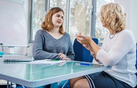 Nursing student discussing their course with a tutor