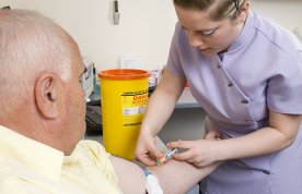 Not all nursing students will have the opportunity to practise venepuncture and cannulation on clinical placement. A nurse is shown performing venepuncture on an older patient