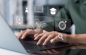 Using AI for nursing degree: a person’s hands typing on a laptop computer, with illustrated icons representing study and technology hovering above them on the image
