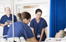 Nurse handover at the bedside: nursing team meets at patient’s beside