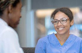 STAR method in nursing: nurse engages happily in work conversation 