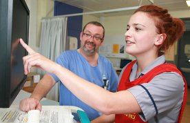Final clinical placement: a nursing student carries out a drug round on a hospital ward while being supervised by a nurse