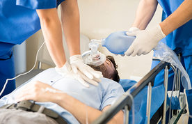 man receiving chest compressions