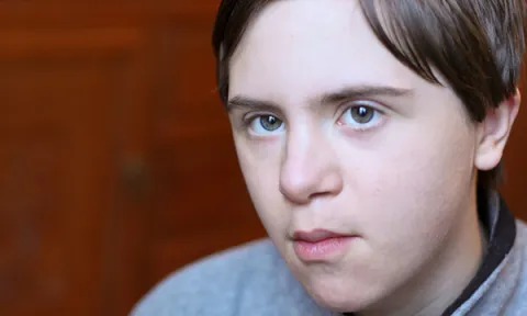 Picture shows a young male who is autistic. Research shows nearly half of autistic children have anxieties specifically associated with autism and commonly related to sensory experiences.