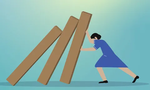 Image of a nurse trying to prop up a line of collapsing columns