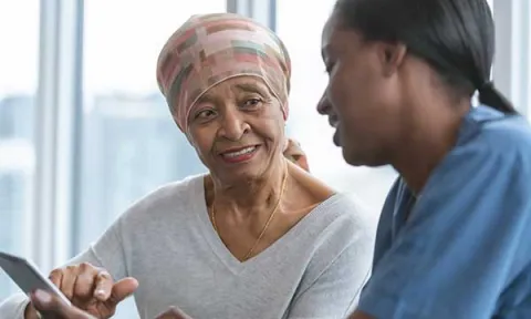 Nurse helping patient choose a cancer treatment