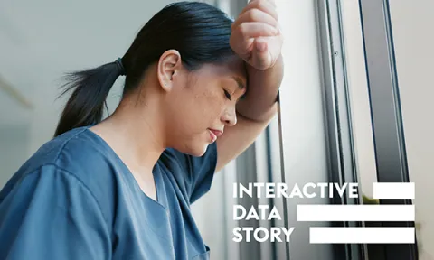 A despairing looking nurse leans against a hospital corridor window: never events, safety critical incidents, can cause serious patient harm or death