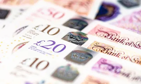 Paying nursing students on placement: close-up of several crisp £10, £20 and £50 notes