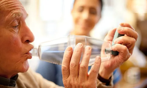 Patient using spacer