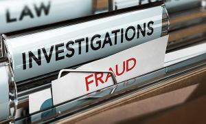 Office filing cabinet drawer is open, revealing files marked ‘investigations’ and ‘fraud’, to illustrate nurses’ removal from NMC register because of test centre fraud