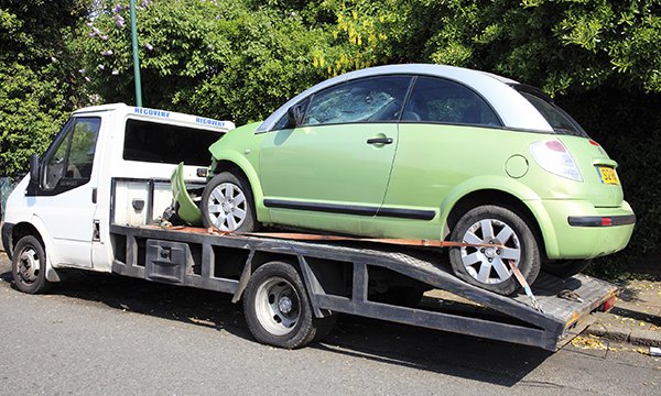 Car on back of pick-up truck