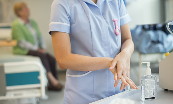 nurse washes her hands