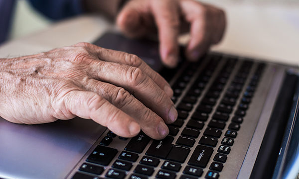 hand on a laptop keyboard