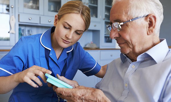 nurse on home visit to patient