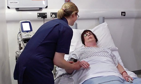 Picture shows a scene from a video featuring a song called Check Me for Sepsis, performed by the Purple All Stars, a group of people with learning disabilities who use the creative arts to convey health promotion messages.