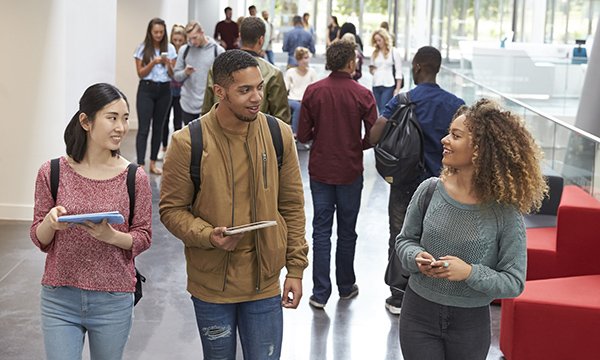 A group of students in a corridor. The next generation need our support to thrive in nursing. Picture: iStock