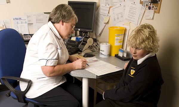 School nurse with a pupil