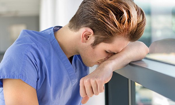 Distressed nurse working in the emergency department