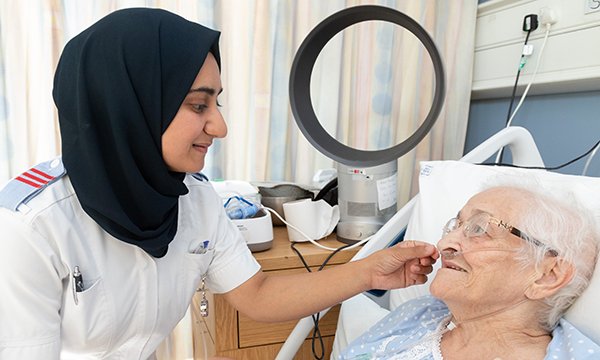 Hospice nurse with a patient – Arthur Rank hospice has become first to join Cavell Nurses Trust employee support scheme