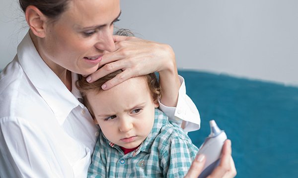 Picture of a mother with child who has fever