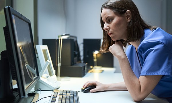 nurse works at computer at work
