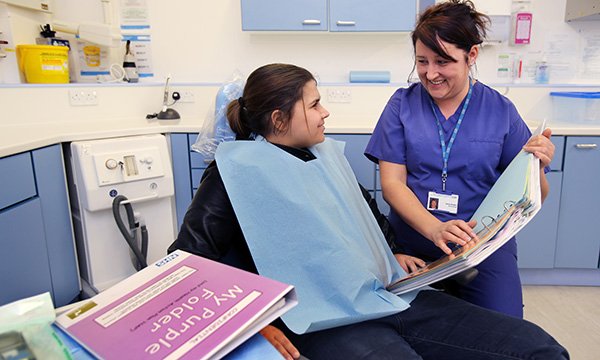 A patient with learning disabilities and a dental nurse. Picture: Tim George