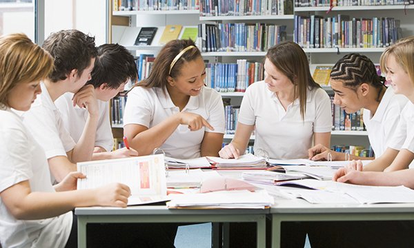Schoolchildren in a classroom. Schools across England, Wales and Scotland will be closed from next week as a result of the coronavirus pandemic