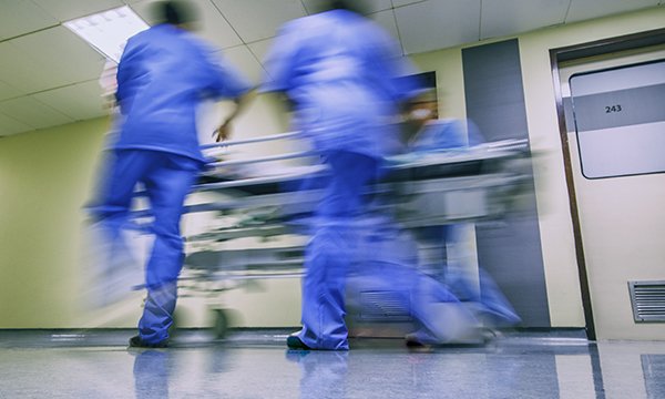Picture shows medics rushing as they push a trolley along a hospital corridor. This article contains excerpts from the diary of an emergency nurse, and are a harrowing and moving account of what it means to be on the front line.