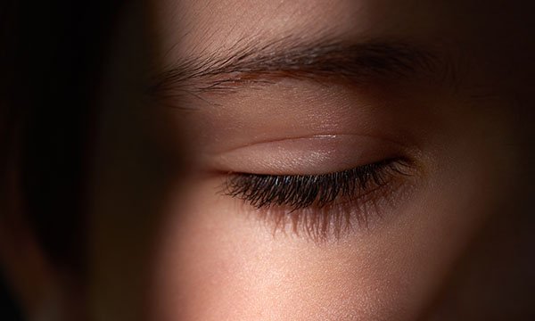 Picture is partial shot of woman’s face with her eye closed. Collaborating with service users on sleep issues is crucial to care outcomes, says occupational therapist Jessica Oglethorpe