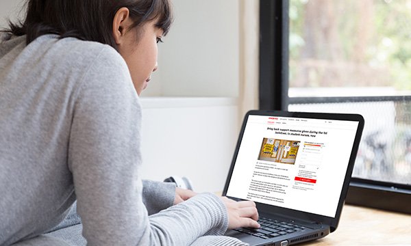 Nursing student studies remotely using her laptop