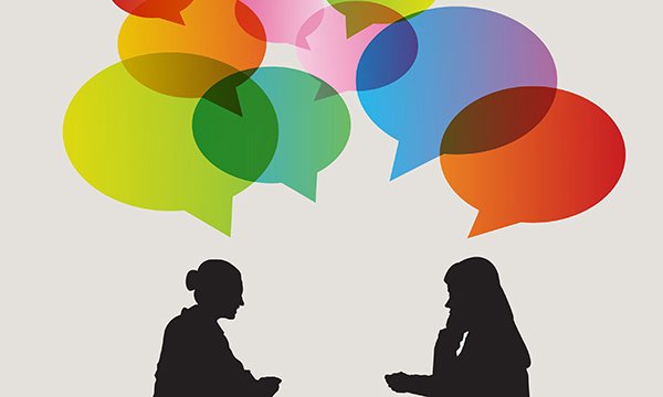 two women taking to each other face to face – as buddy scheme starts that aims to support NMC registrants facing FtP