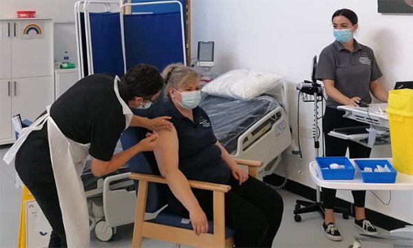 Orthopaedic nurse Ewa Syczuk receives the booster vaccination for COVID-19
