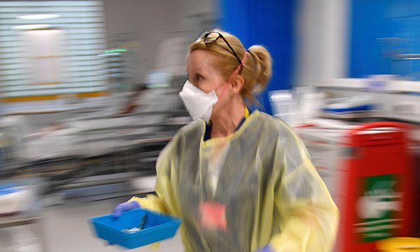 Picture shows a female medic in protective clothing
